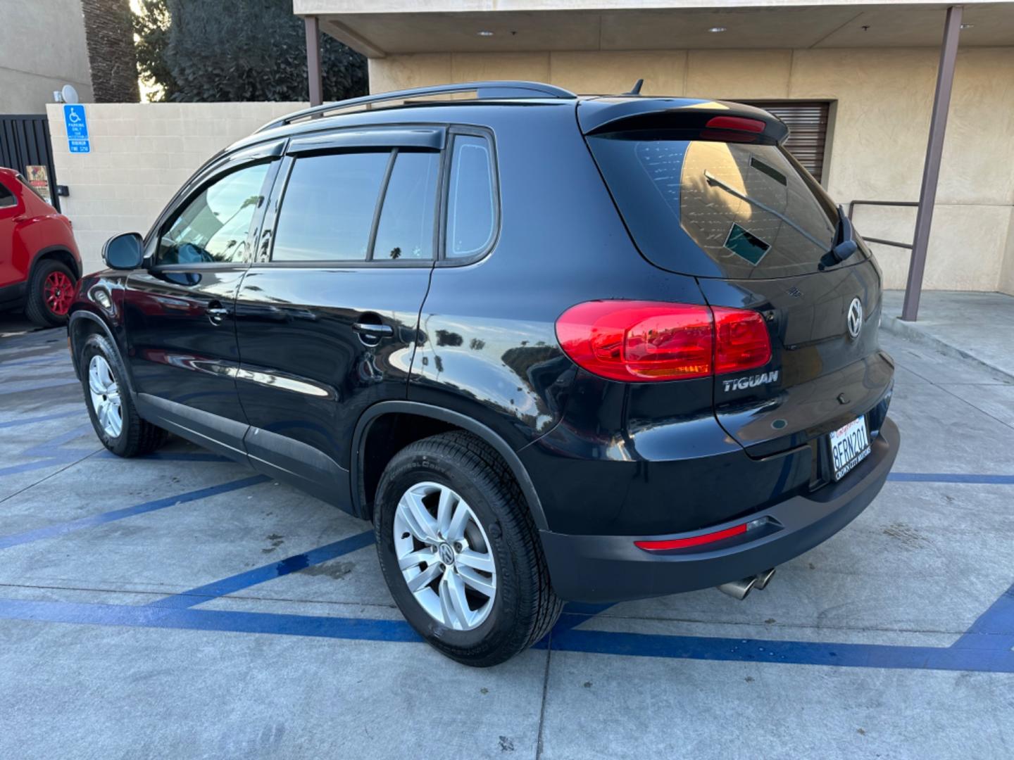 2016 Black /Black Volkswagen Tiguan (WVGAV7AX5GW) , AUTOMATIC transmission, located at 30 S. Berkeley Avenue, Pasadena, CA, 91107, (626) 248-7567, 34.145447, -118.109398 - Crown City Motors is a used “Buy Here Pay Here” car dealer in Pasadena CA. “Buy Here Pay Here” financing, means that when you purchase your vehicle from our dealership, that you make the payments to the dealership as well. We do not need the banks approval to get you approved for a used auto - Photo#3